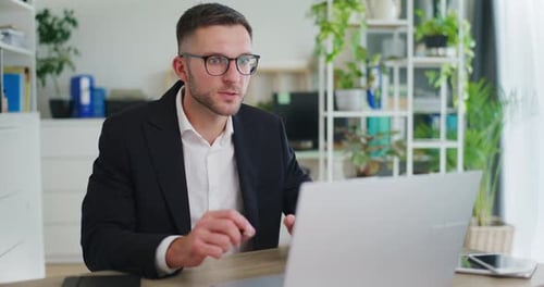 Businessman Talking on Video Call with Client