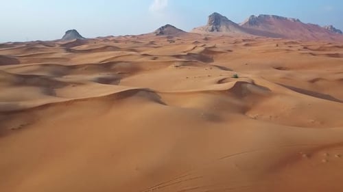 Breathtaking Cinematic Shot of a Remote Desert with Smooth Sand Waves