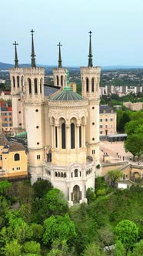 Aerial, drone view of the Basilica of Notre Dame of Fourviere in Lyon, France. Vertical