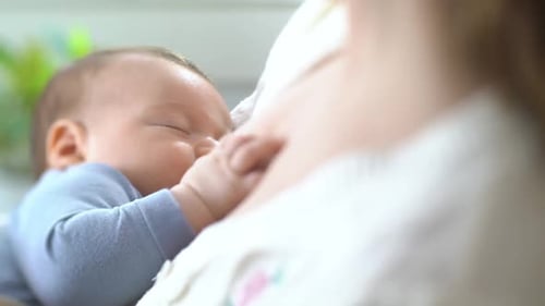 Baby Resting Peacefully in Mother's Arms