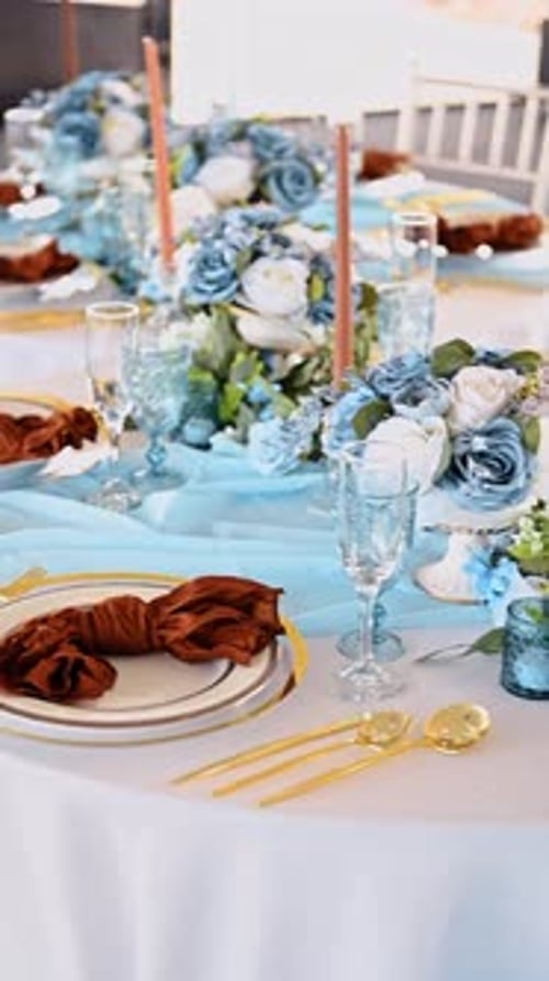 Elegant Wedding Table Setting with Blue and Gold Details