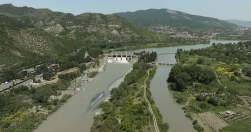 Aerial View Of Dam In The Mtkvari River With Caucasus Mountain Views In Georgia.