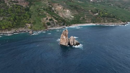 Dramatic Color of the Sea Waves Crashing Against the Rocks Aerial View on a Wild Beach