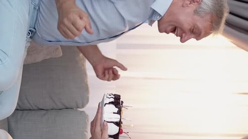 Man Celebrates Birthday with Cake and Kiss