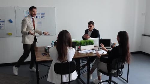 Enthusiastic Business Presentation in a Modern Office