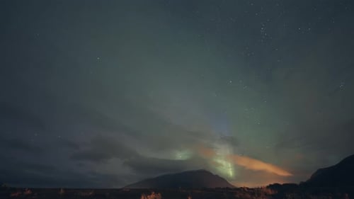 Enchanting show of the aurora borealis in the dark night sky.