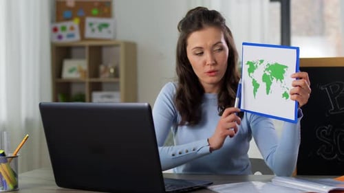 Distant Education, Primary School And Teaching Concept - Female Teacher With Laptop Computer Havi...