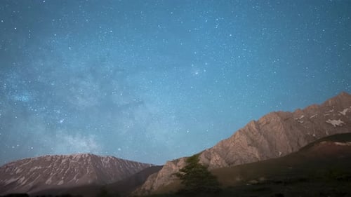 Time lapse of a starry night sky clouds