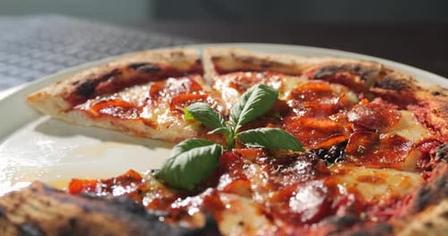 Close-Up of Delicious Pepperoni Pizza with Basil