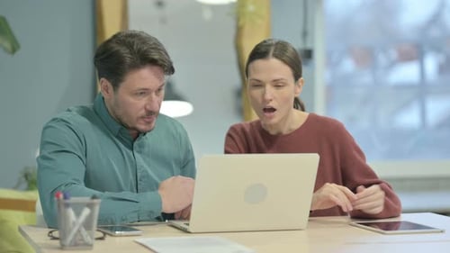 Creative People Discussing Work in Office