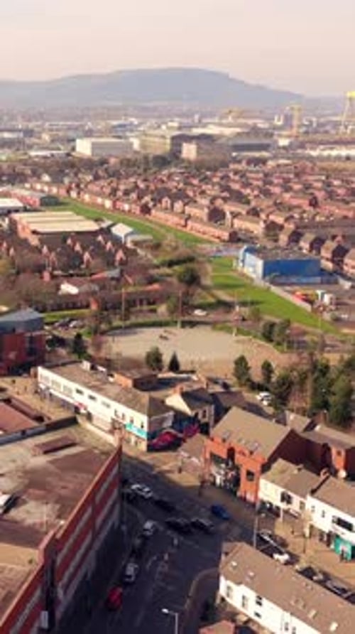 Approaching 60FPS vertical social ratio aerial video of C.S. Lewis Square in East Belfast, NI