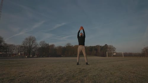 Morning Training Of Young Athlete In Park Man Does Physical Exercises For His Hands