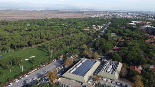 golf course and luxury hotel between trees aerial drone 4kHotel Golf Court 2