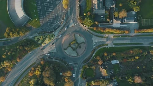 Aerial top down view, roundabout with traffic approaching and leaving it.