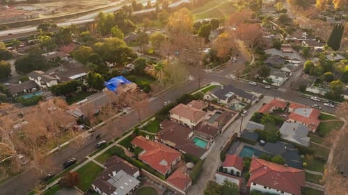 Aerial Footage of Upscale Neighborhood in California at Sunset, Establishing Shot of Large Homes wit