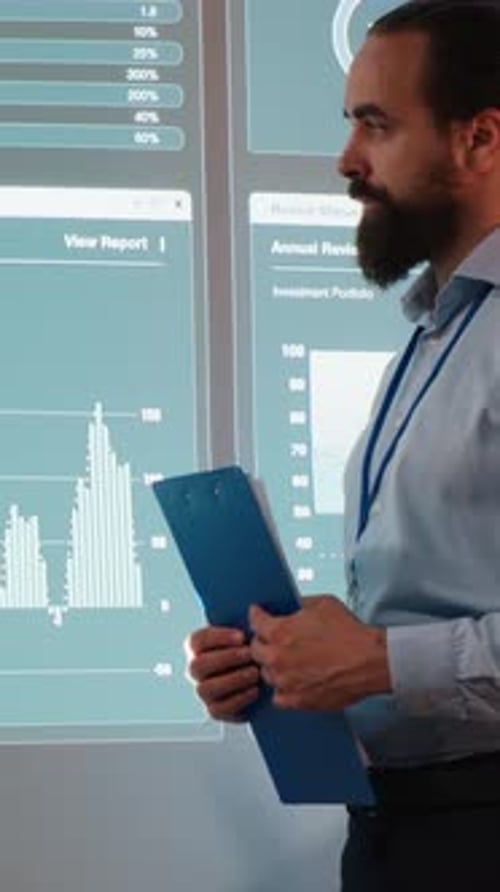 Vertical Video Multiethnic Staff Members Examining Data Insights to Evaluate Business Activity