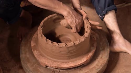 Hands Molding Clay on a Pottery Wheel