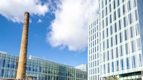 Office Building in Barcelona with Passing Clouds