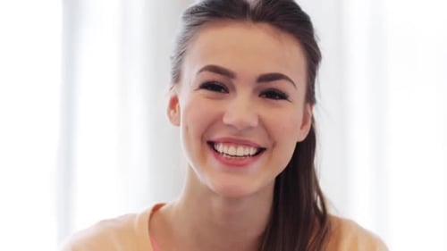 Smiling Woman Portrait in Bright Indoor Setting