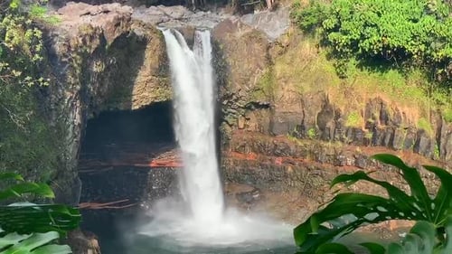 Rainbow Falls is a natural waterfall surrounded by the tropical rainforests of Hawaii. HILO, Big Isl