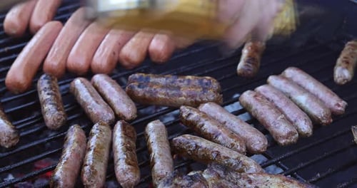 A Picnic Flaming Grill Was Used to Grill Barbecue Pork Sausages on the Picnic Ground