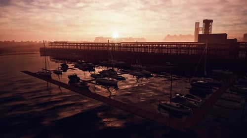 Sunset Over Harbor With Boats