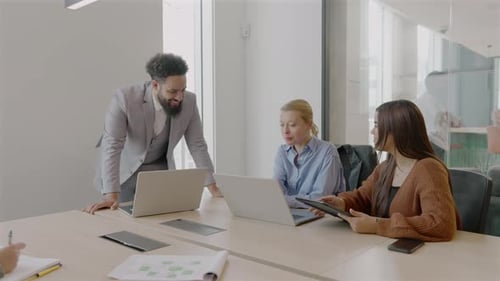 A Diverse Team Collaborating in a Modern Office Engaging in Idea Generation Together