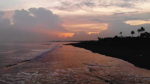 Beautiful footage of a atmospheric sunset at the beach, shot in Bali, Indonesia.