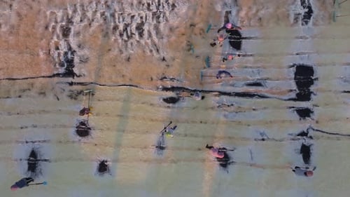 Aerial view of salt harvesting in traditional Thai coastal farms