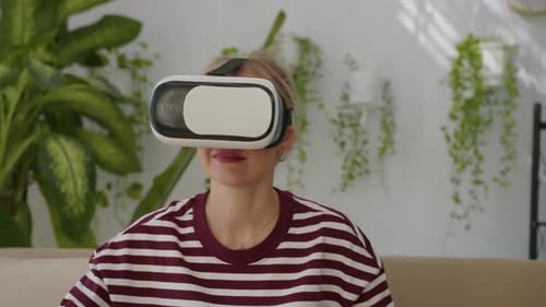 Woman Using Virtual Reality Headset in Living Room