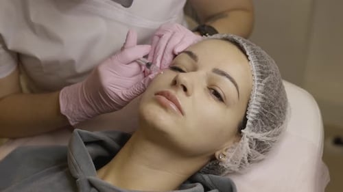 Woman Receiving Cosmetic Injections in Her Face