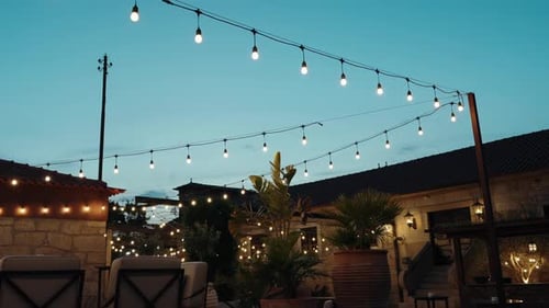 Charming Illuminated Outdoor Lounge at Dusk