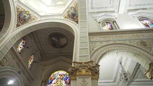 old structure of a church inside, full of mosaics and religious details on the walls