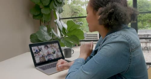 Woman Participating in Video Conference at Home