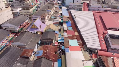 Drone capture of Talad Rom Hub with market and train tracks, Thailand