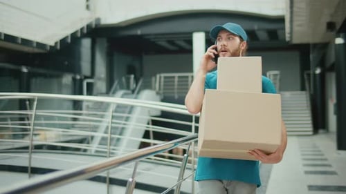 Delivery Person Using a Smartphone to Searching for Fast Delivery Addresses
