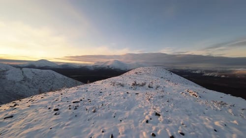 Snowy Mountain Peaks at Sunrise in Winter