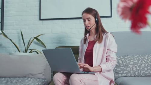 Attractive Young Business Woman with Headset Conferencing in Webcam Chat Female Call Center Agent