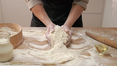 Hands Preparing Dough in Bright Kitchen