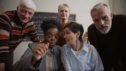 Senior Adults Learn Technology in Bright Classroom Setting