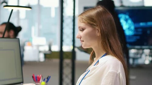 Female Technician Using AI LLM Chatbot to Automate Tasks in Office