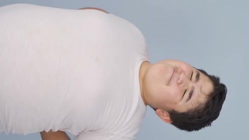 Vertical Video of Boy with Back Pain.