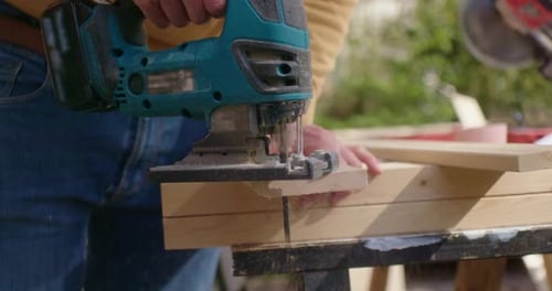 Close up when cutting the corner of the piece of wood
