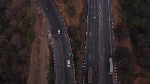 Multi lane Pune Mumbai Expressway carved through the mountain valley, Lonavala, Maharashtra, Drone