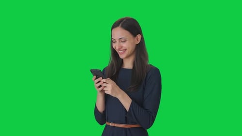 Happy Indian girl chatting with someone Green screen