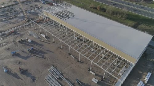 Drone shot of framework on a construction site.