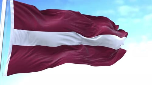 Latvia Flag Waving Proudly in the Wind with a Blue Sky Background