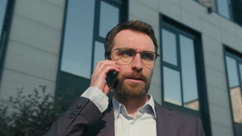 Angry Mad Caucasian Businessman Shout at Mobile Phone in City Annoyed Stressed Man Talk Smartphone