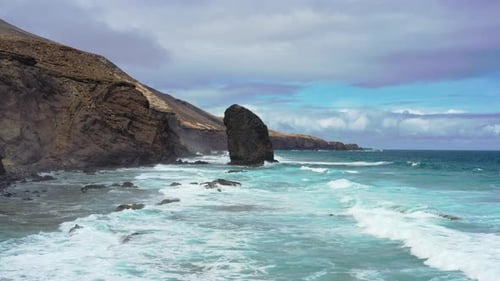 Aerial view of Cofete Beach with Roque del Moro on a cloudy day, Fuerteventura
