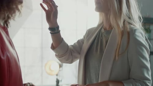Make-up Artist Applying Cosmetics on Model in Studio